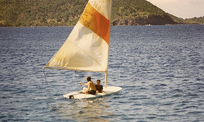 sc0003912601.jpg - The boat also had a Sun Fish, which Dan took to like a fish to water.  Kathy and Dan sailing.